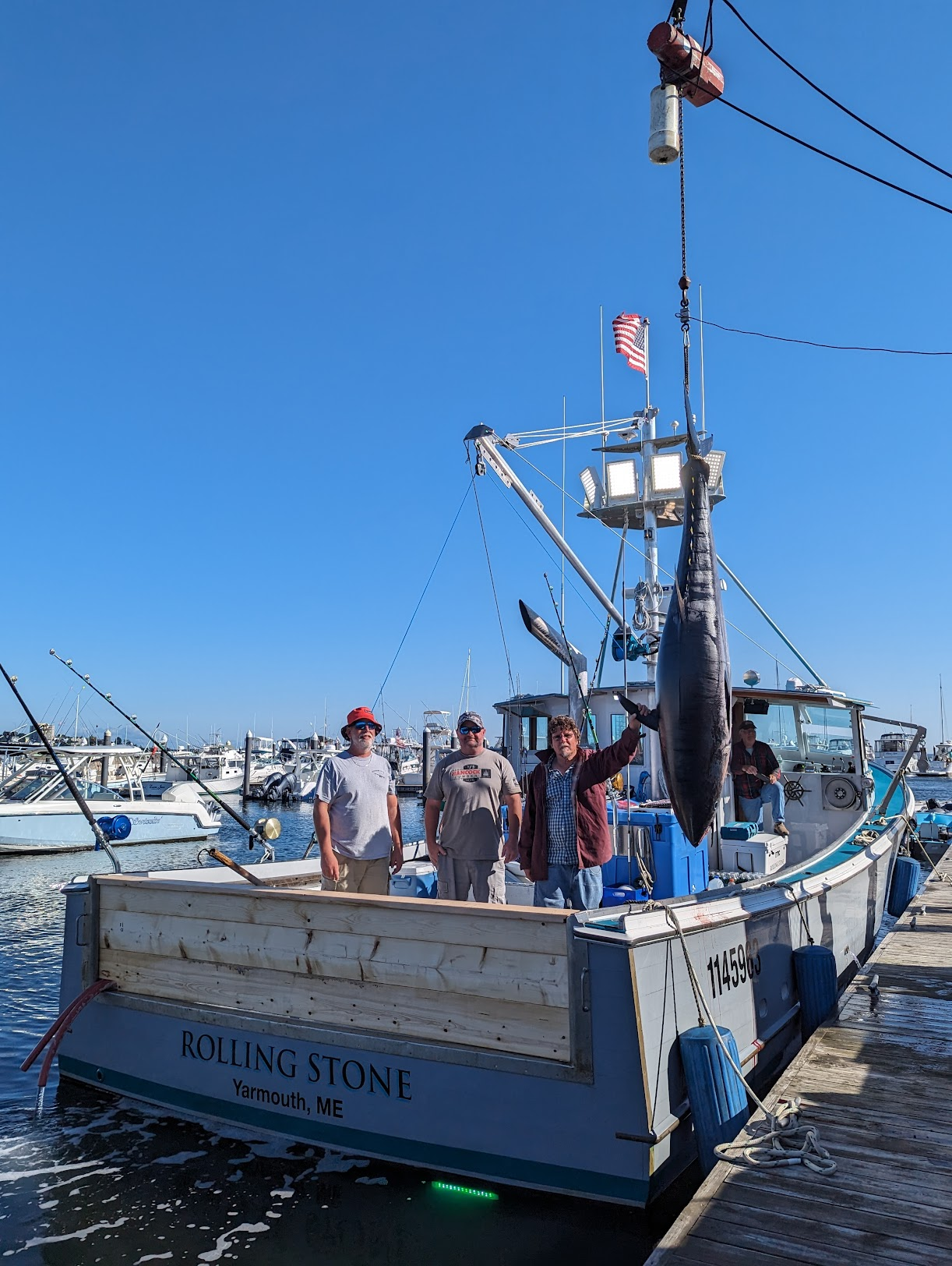 Anglers with catch on fishing boat
